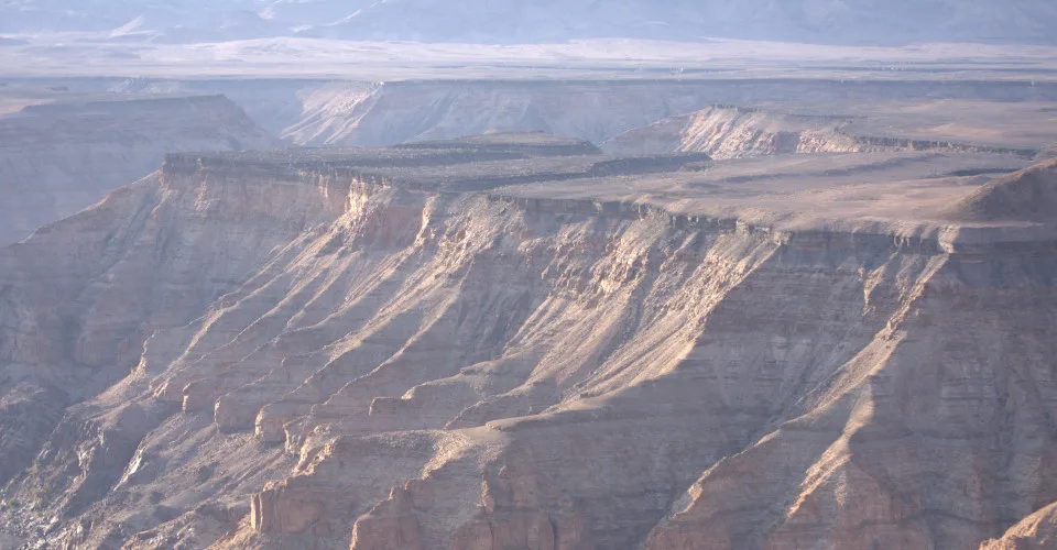 Full panoramic view across the Fish River Canyon, the river visible as a silver thread far below